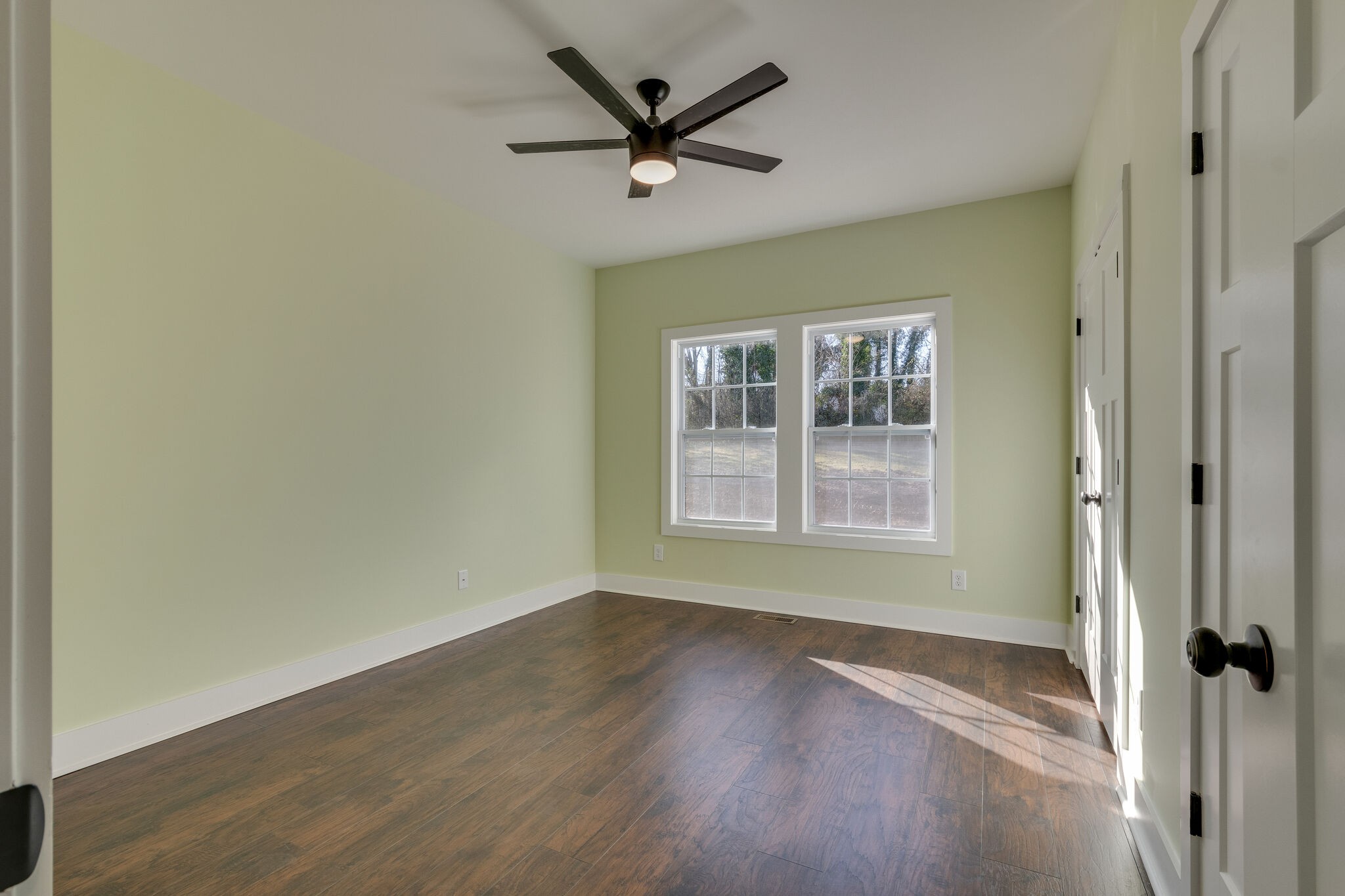 1004 Bridge Street Columbia, TN 38401 - Photo 15 of 25 a view of a livingroom with a hardwood floor and a ceiling fan