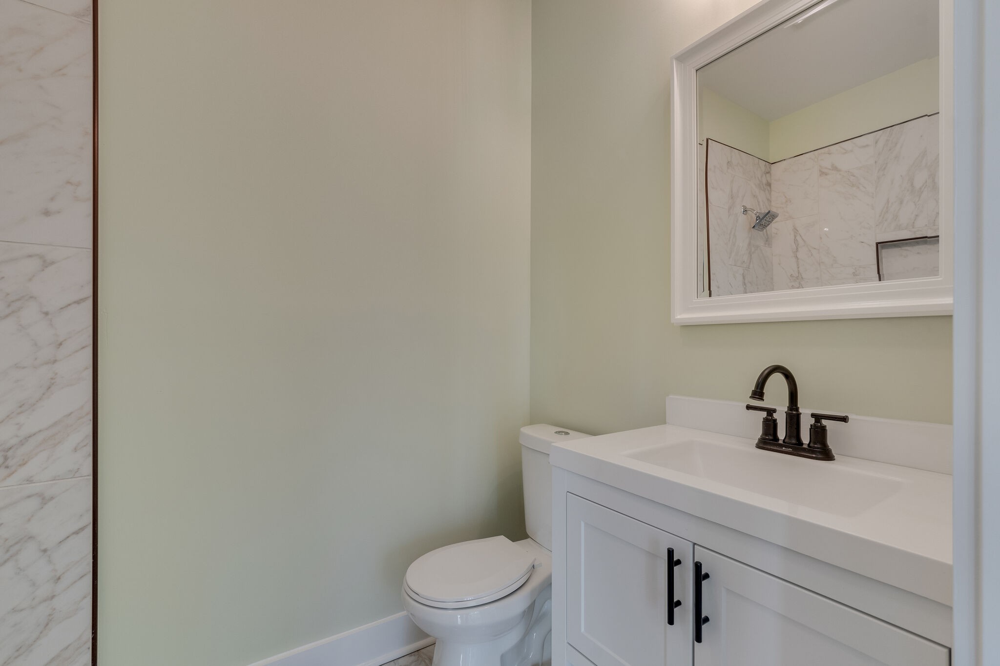 1004 Bridge Street Columbia, TN 38401 - Photo 17 of 25 a bathroom with a toilet a sink and mirror