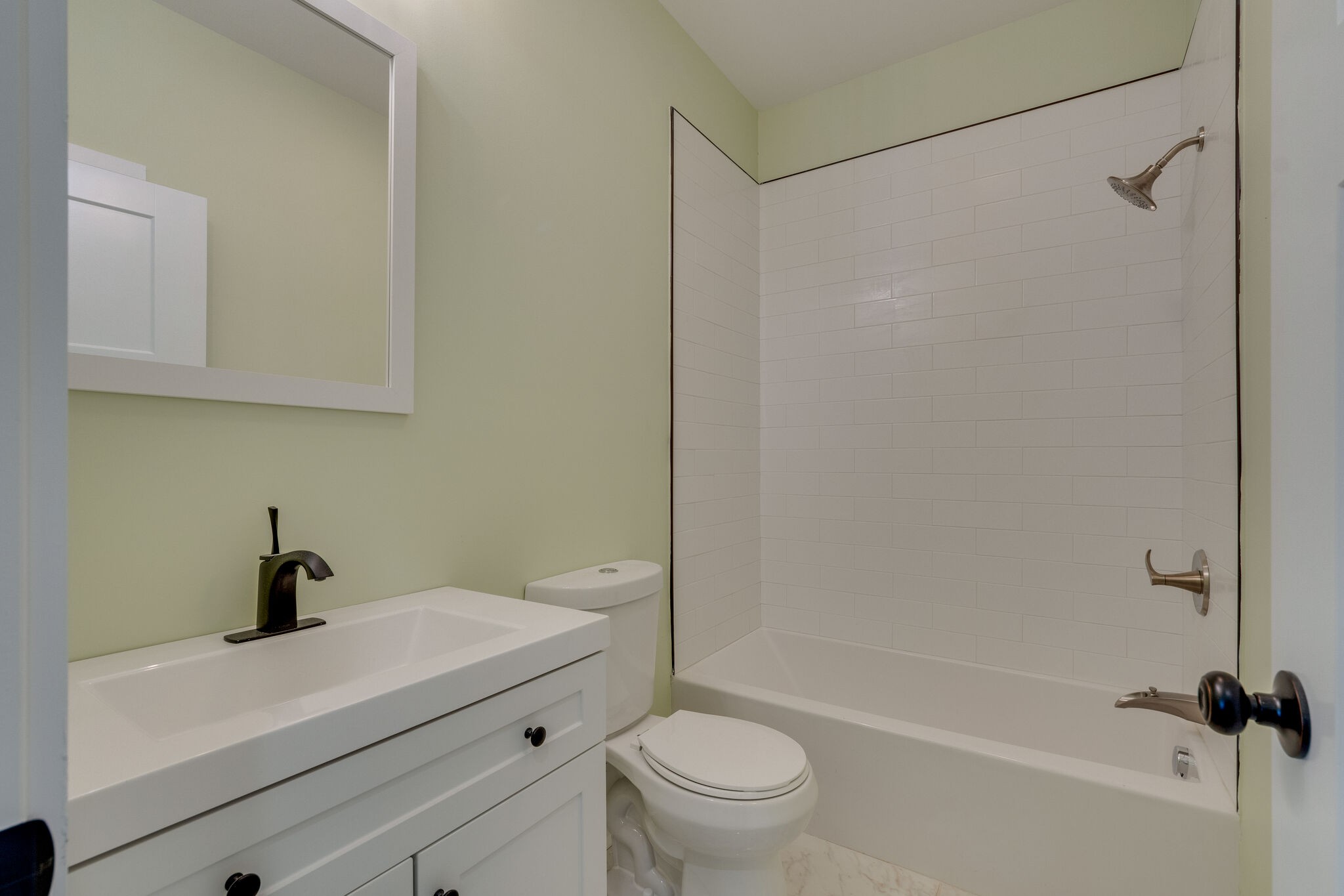 1004 Bridge Street Columbia, TN 38401 - Photo 20 of 25 a bathroom with a sink a toilet and a bathtub