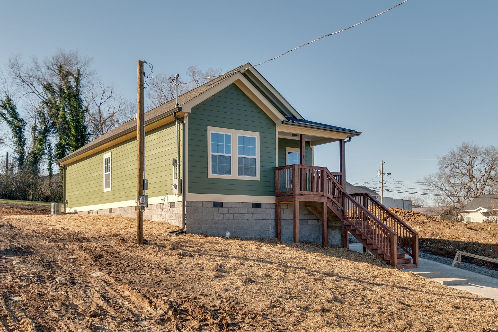 1004 Bridge Street Columbia, TN 38401 - Photo 3 of 25 a front view of a house with a yard and garage