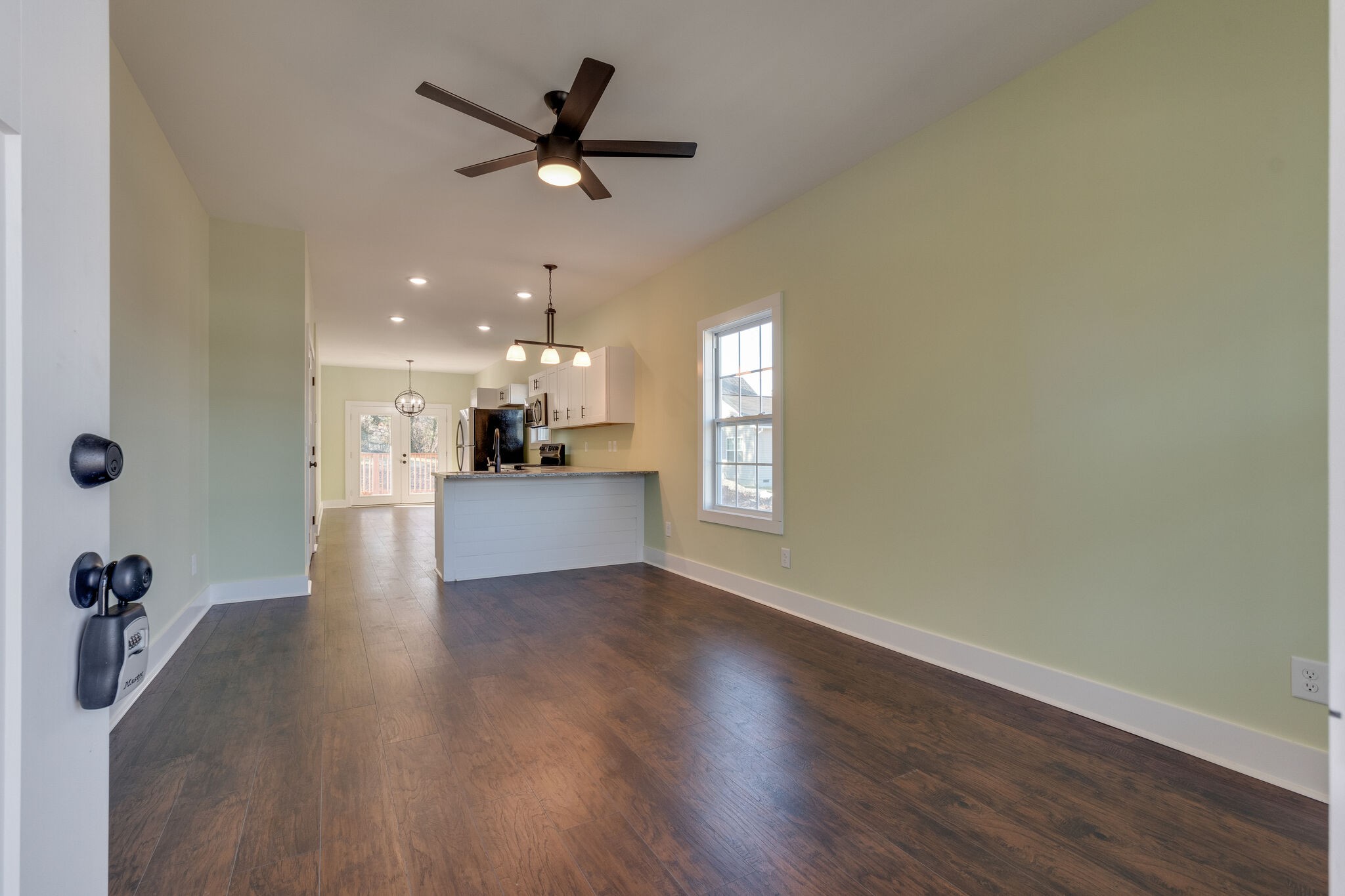 1004 Bridge Street Columbia, TN 38401 - Photo 6 of 25 a view of a livingroom with a hardwood floor and a ceiling fan