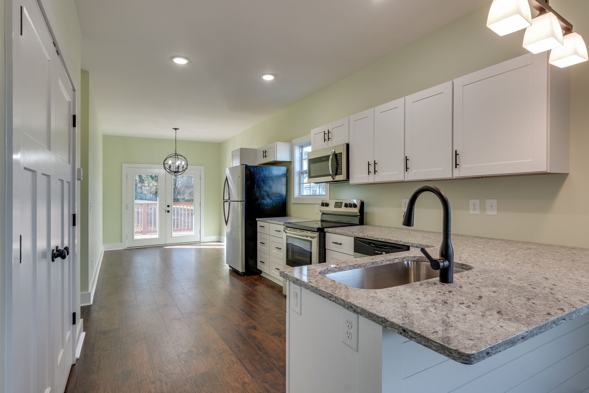 1004 Bridge Street Columbia, TN 38401 - Photo 9 of 25 a kitchen with stainless steel appliances granite countertop a sink stove and refrigerator