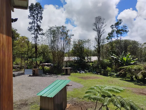 a view of a backyard with sitting area