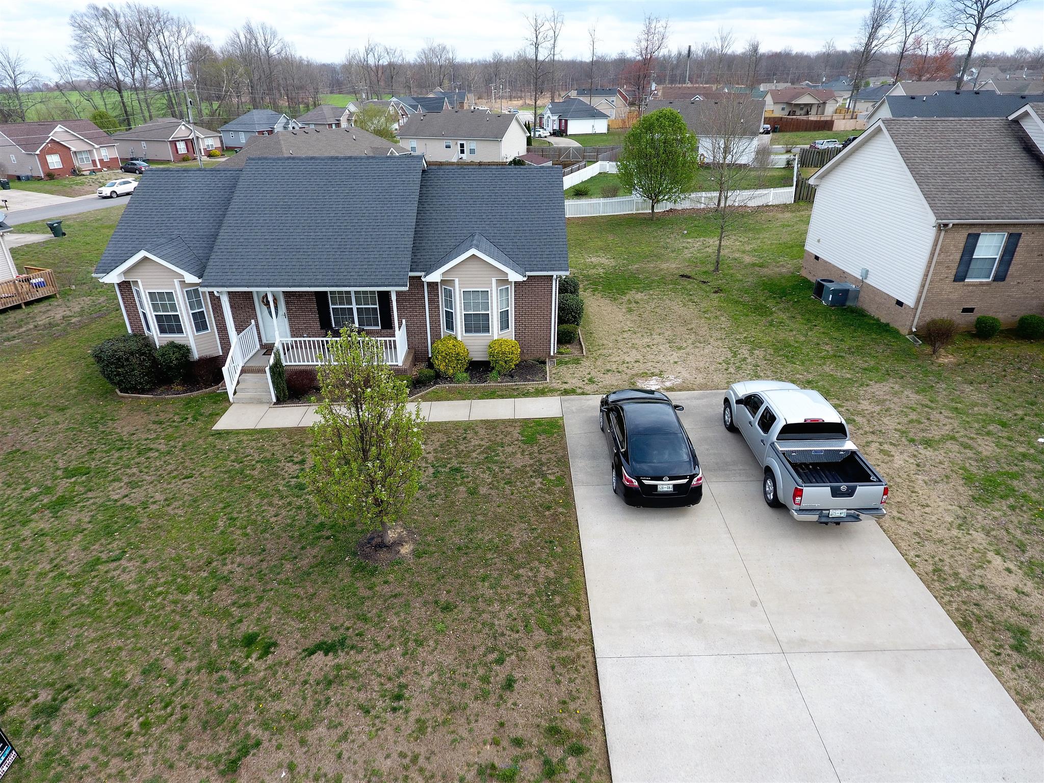 111 Filly Lane Springfield, TN 37172 - Photo 1 of 14 an aerial view of a house with garden space and a car parked on the side of the road