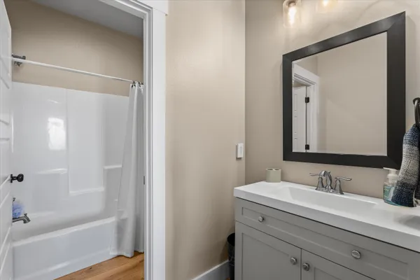 a bathroom with a sink and a mirror