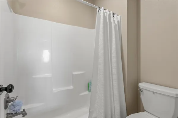 a bathroom with a bathtub a sink and a mirror