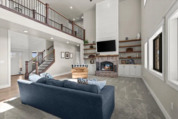 a living room with furniture fireplace and a flat screen tv