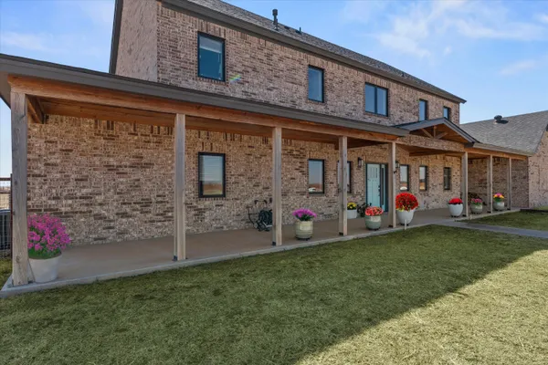 a view of a garage with a bike and a car