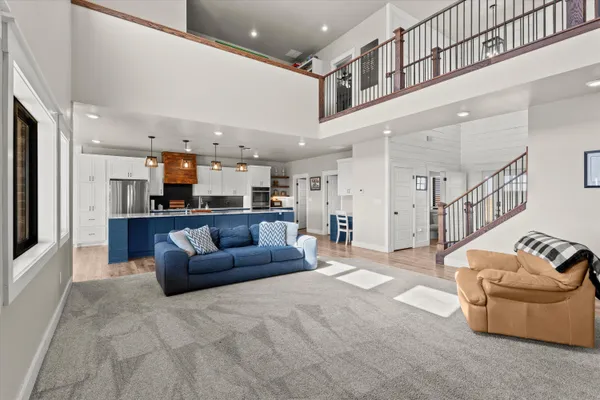 a kitchen with wooden floors and wooden cabinets