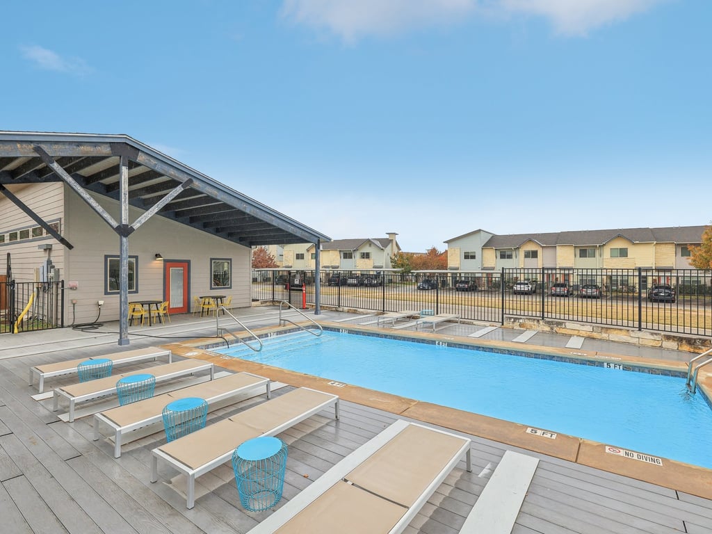 7805 Cooper Lane, Unit 608 Austin, TX 78745 - Photo 28 of 31 a view of a swimming pool and lounge chairs