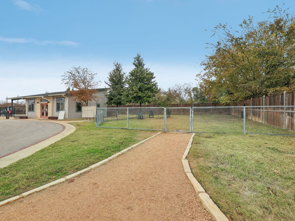 7805 Cooper Lane, Unit 608 Austin, TX 78745 - Photo 30 of 31 a view of a house with a yard