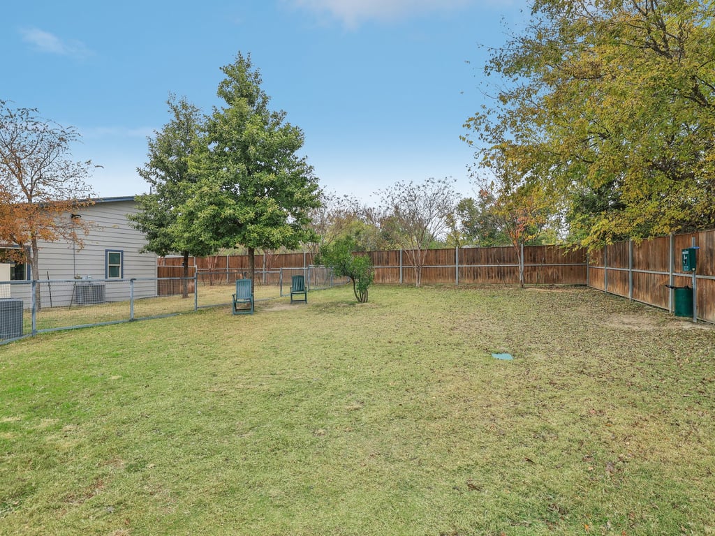 7805 Cooper Lane, Unit 608 Austin, TX 78745 - Photo 31 of 31 a backyard of a house with lots of green space