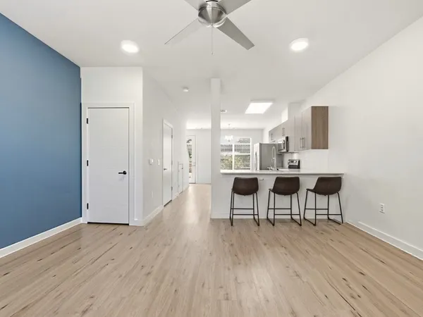 a view of a dining room with furniture and wooden floor