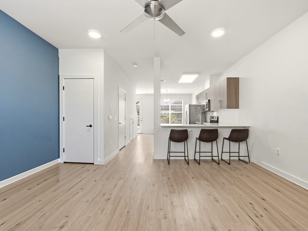 7805 Cooper Lane, Unit 608 Austin, TX 78745 - Photo 5 of 31 a view of a dining room with furniture and wooden floor