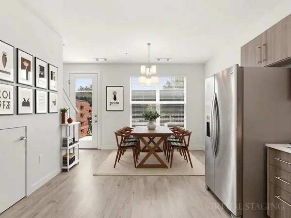a view of a dining room with furniture window and wooden floor