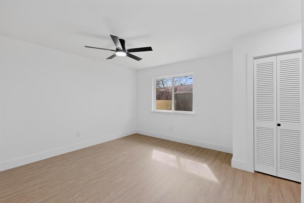 3318 Ridgefield Street Irving, TX 75062 - Photo 14 of 33 an empty room with windows and fan