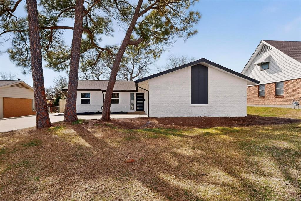 3318 Ridgefield Street Irving, TX 75062 - Photo 2 of 33 a view of a house with a yard