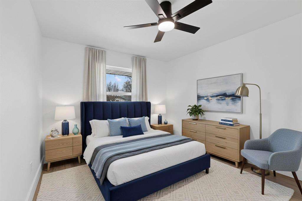 3318 Ridgefield Street Irving, TX 75062 - Photo 22 of 33 a bedroom with a bed and a chair