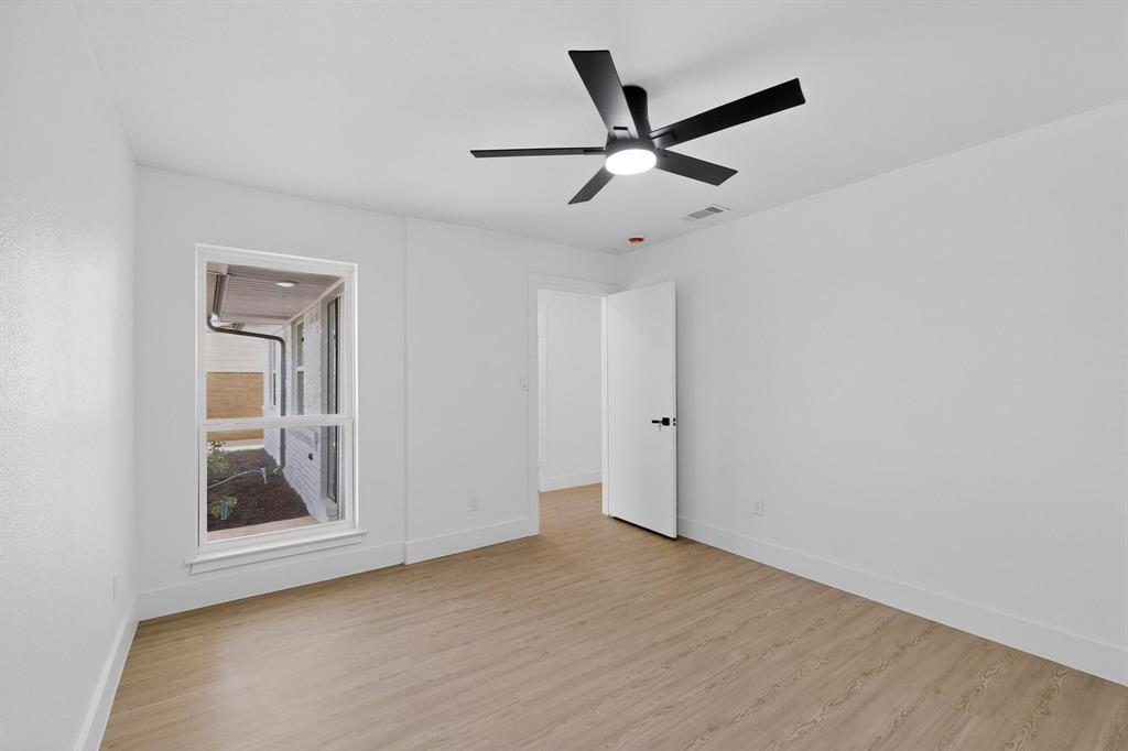 3318 Ridgefield Street Irving, TX 75062 - Photo 27 of 33 a view of a big room with wooden floor and closet