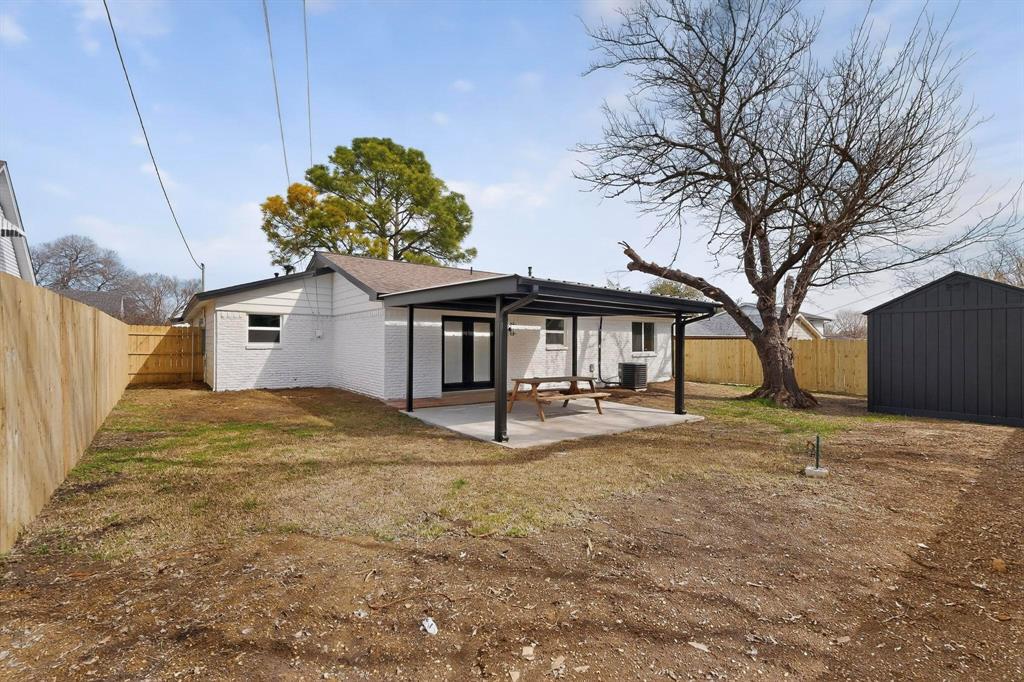 3318 Ridgefield Street Irving, TX 75062 - Photo 30 of 33 a view of a house with large trees and wooden fence