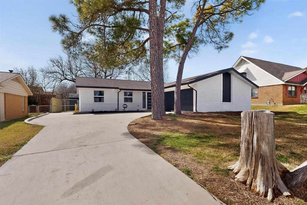 3318 Ridgefield Street Irving, TX 75062 - Photo 3 of 33 a view of a house with a yard