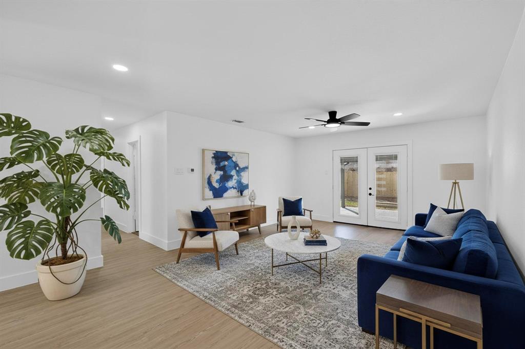 3318 Ridgefield Street Irving, TX 75062 - Photo 5 of 33 a living room with furniture and a potted plant