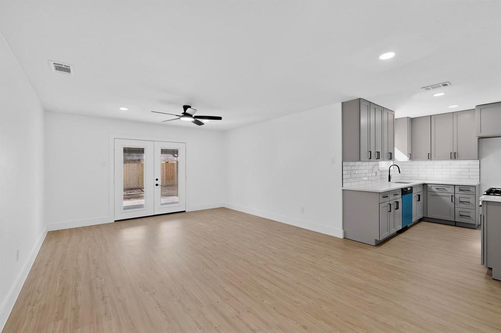 3318 Ridgefield Street Irving, TX 75062 - Photo 7 of 33 a kitchen with a sink cabinets and wooden floor