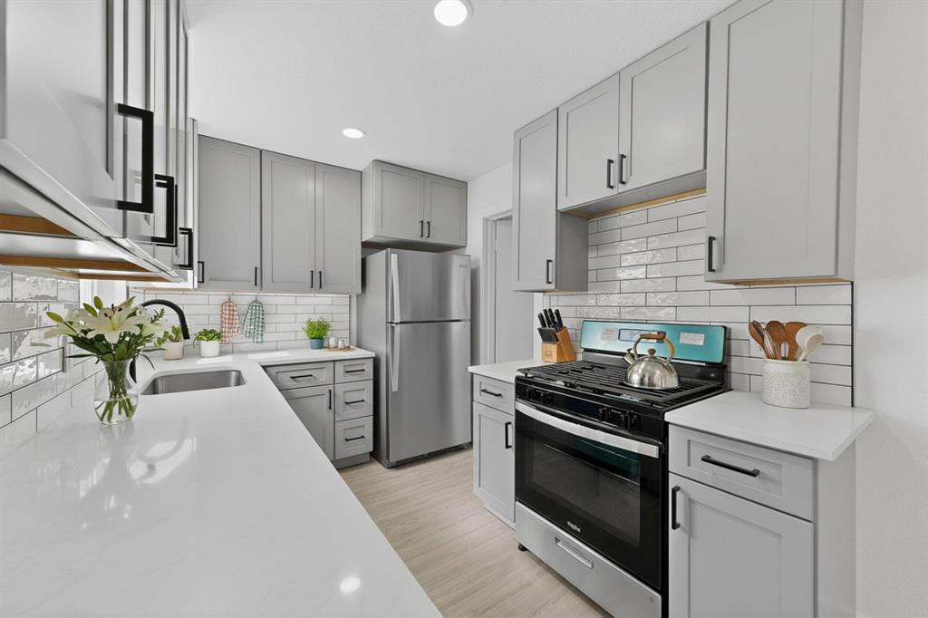 3318 Ridgefield Street Irving, TX 75062 - Photo 8 of 33 a kitchen with a sink appliances and cabinets