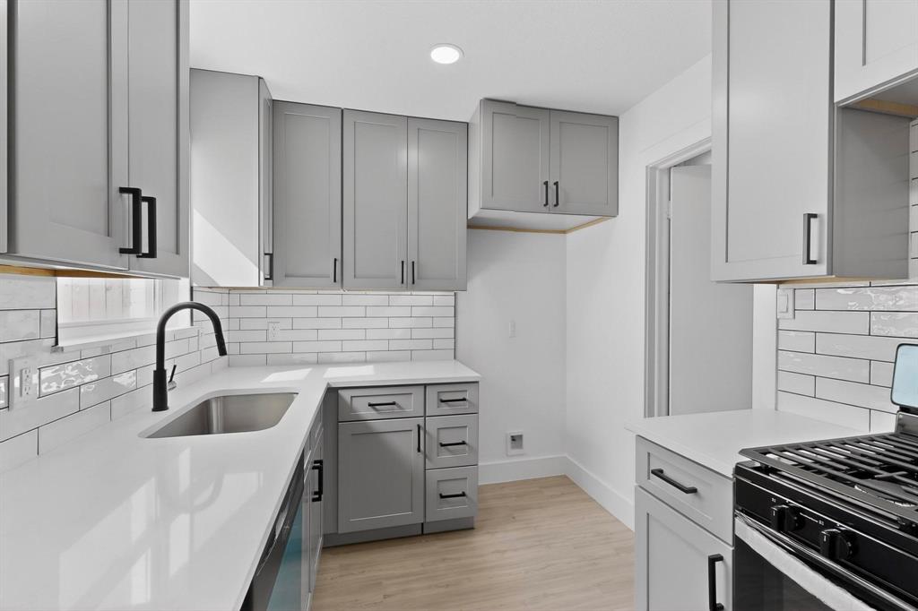3318 Ridgefield Street Irving, TX 75062 - Photo 9 of 33 a kitchen with a sink stove and refrigerator