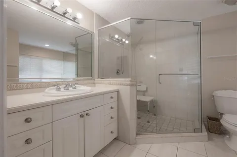a living room with furniture large window and a fireplace