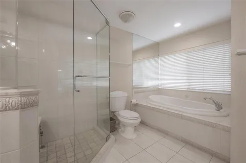 a kitchen with stainless steel appliances granite countertop a stove top oven a sink a counter top space and cabinets