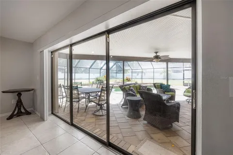 a bathroom with a granite countertop sink a toilet a mirror and a shower