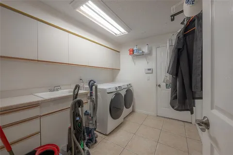 a bathroom with a shower curtain and a window