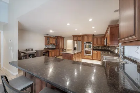 a view of a swimming pool with a patio and swimming pool
