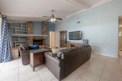 a view of a patio with chairs and plants
