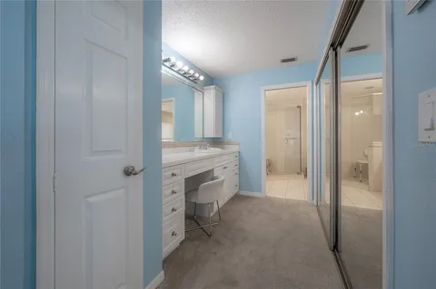 a kitchen with granite countertop a stove microwave and sink