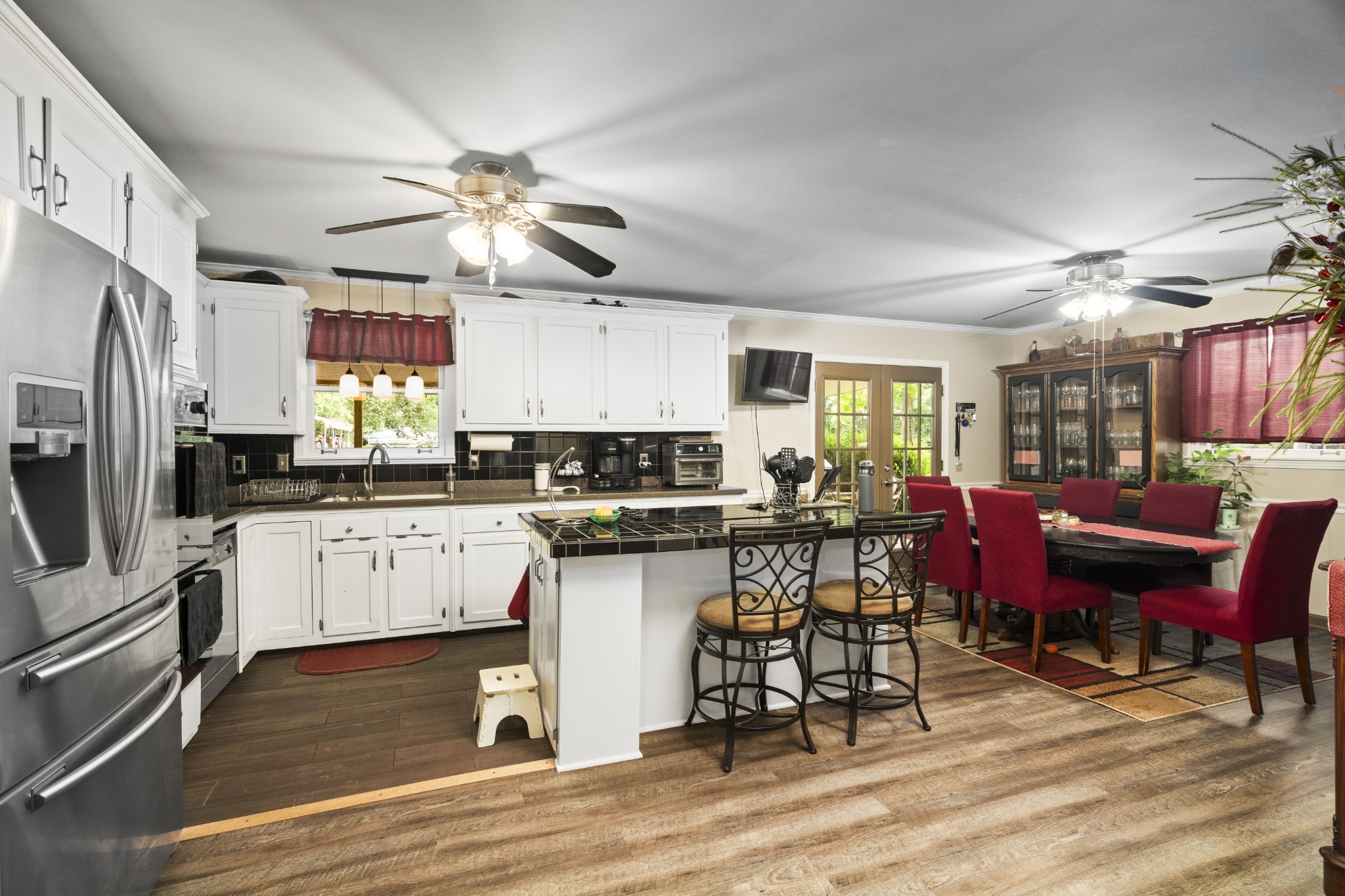 3828 Martins Chapel Road Springfield, TN 37172 - Photo 18 of 51 a kitchen with a table chairs refrigerator and cabinets