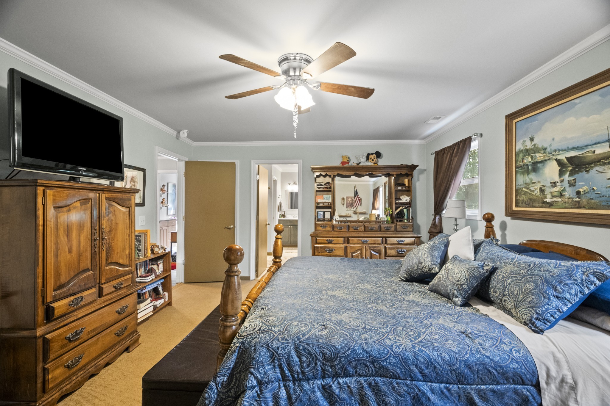 3828 Martins Chapel Road Springfield, TN 37172 - Photo 30 of 51 a spacious bedroom with a bed and a flat screen tv