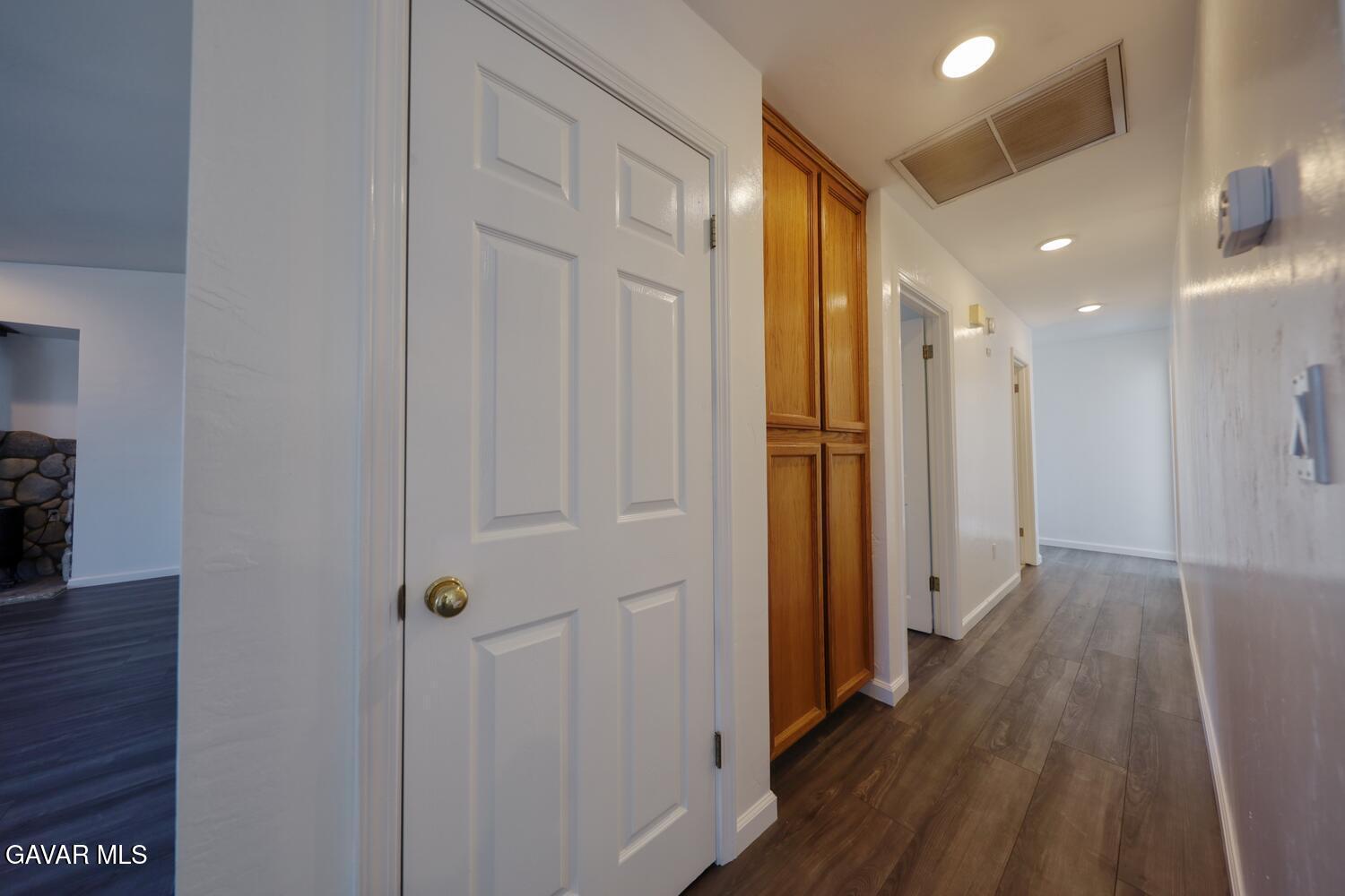 26801 Cabriolet Court Tehachapi, CA 93561 - Photo 20 of 60 a view of a hallway with wooden floor