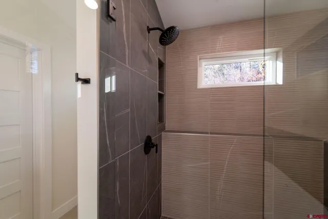 a white bath tub sitting in a bathroom