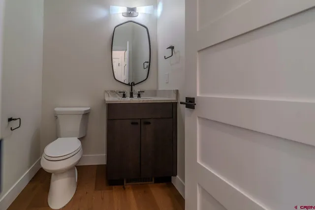 a bedroom with a bed and a potted plant