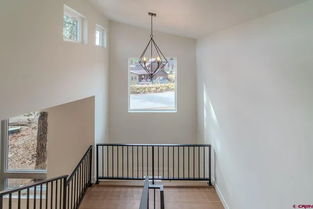 a room with ceiling fan and window
