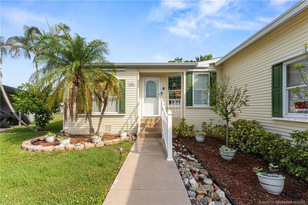 4237 4th Court Lantana, FL 33462 - Photo 4 of 40 a front view of a house with garden