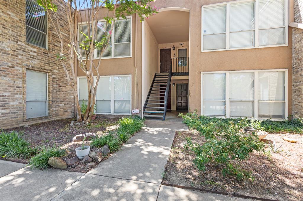 5634 Boca Raton Boulevard, Unit 209 Fort Worth, TX 76112 - Photo 5 of 24 a front view of a house with a yard