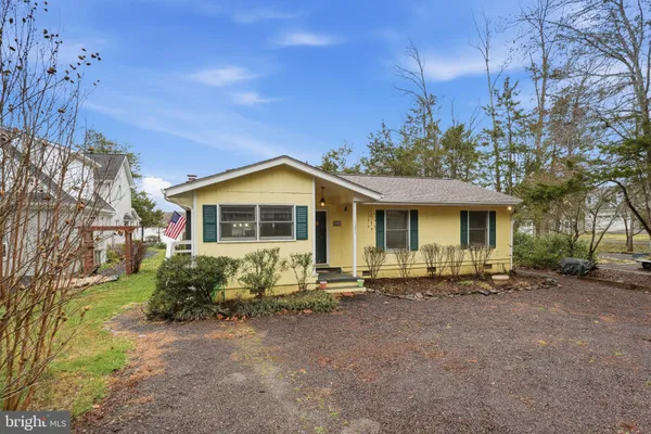 a view of a dining area with furniture and wooden floor