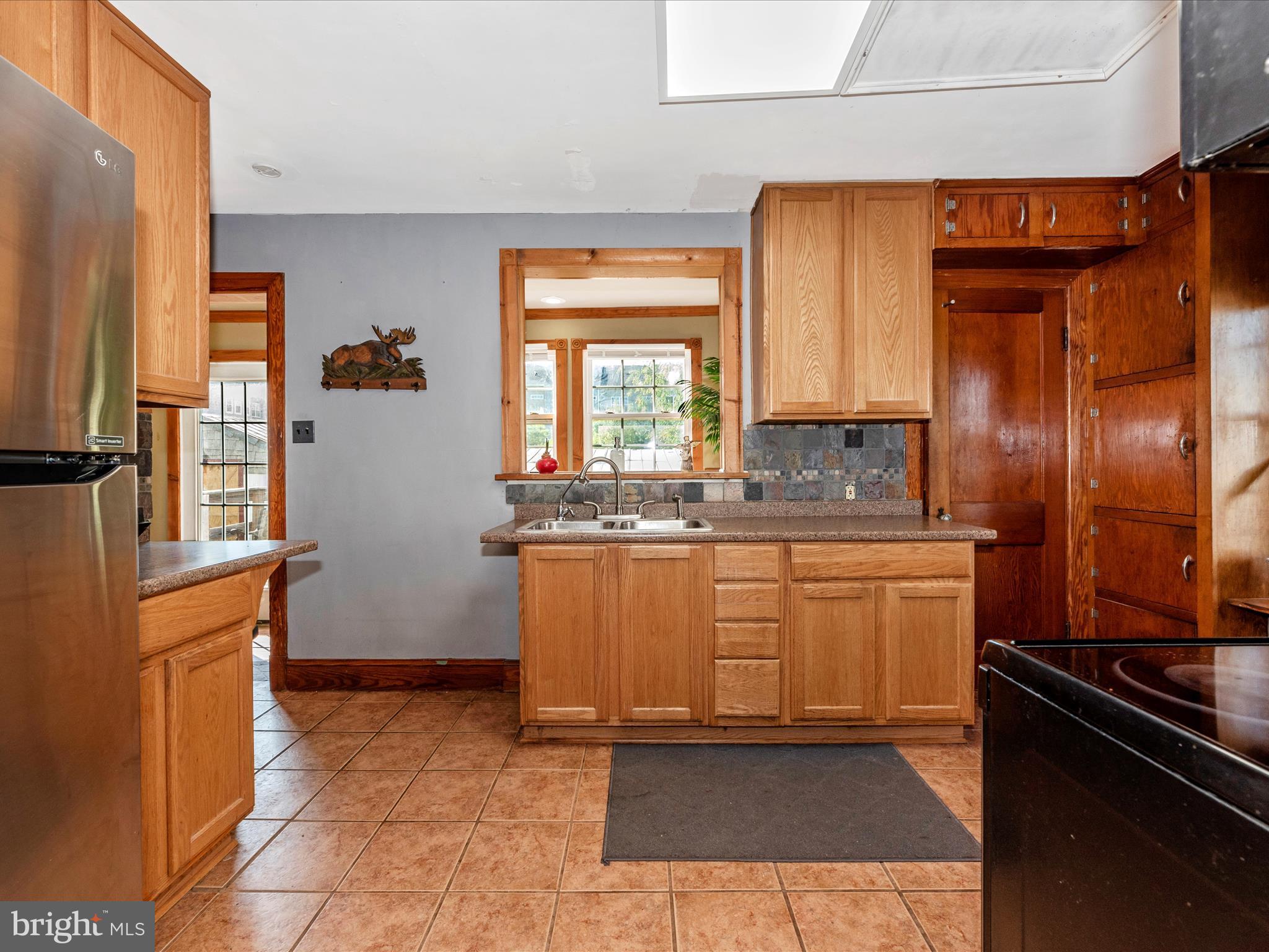 6103 Jefferson Pike Frederick, MD 21703 - Photo 12 of 57 a kitchen with stainless steel appliances granite countertop a refrigerator and a stove