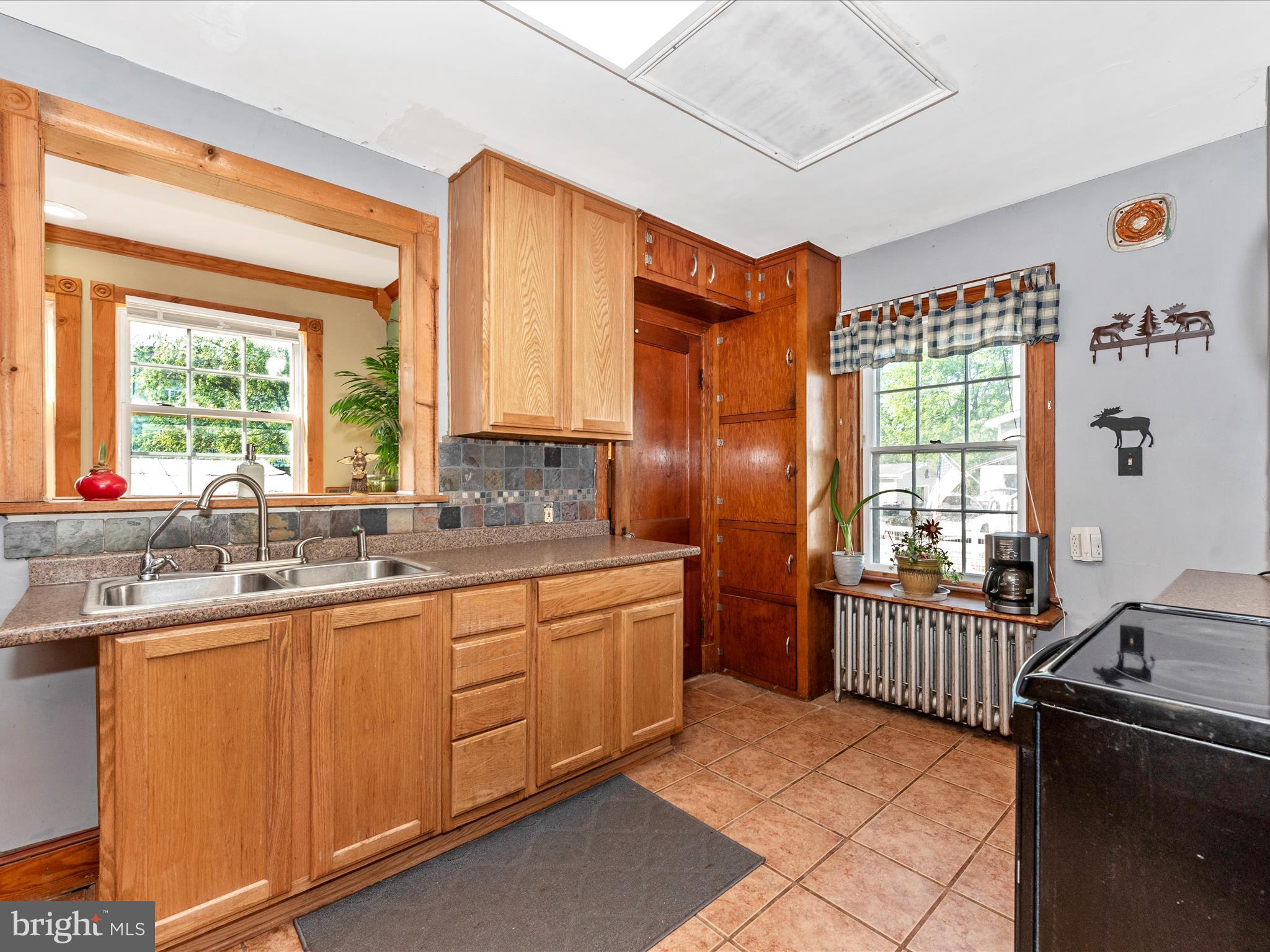 6103 Jefferson Pike Frederick, MD 21703 - Photo 13 of 57 a kitchen with stainless steel appliances granite countertop a sink stove and refrigerator