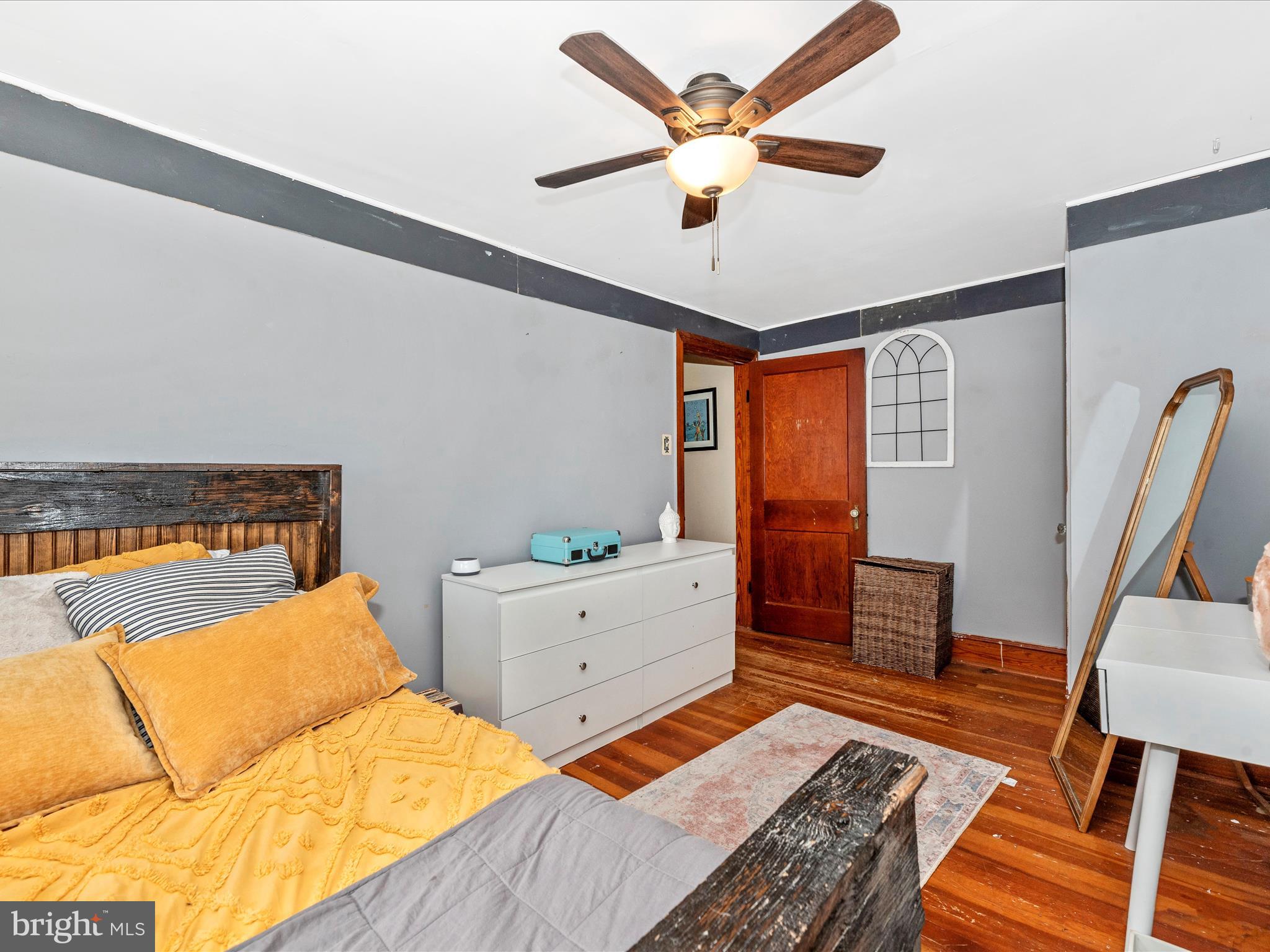 6103 Jefferson Pike Frederick, MD 21703 - Photo 29 of 57 a bedroom with furniture and wooden floor