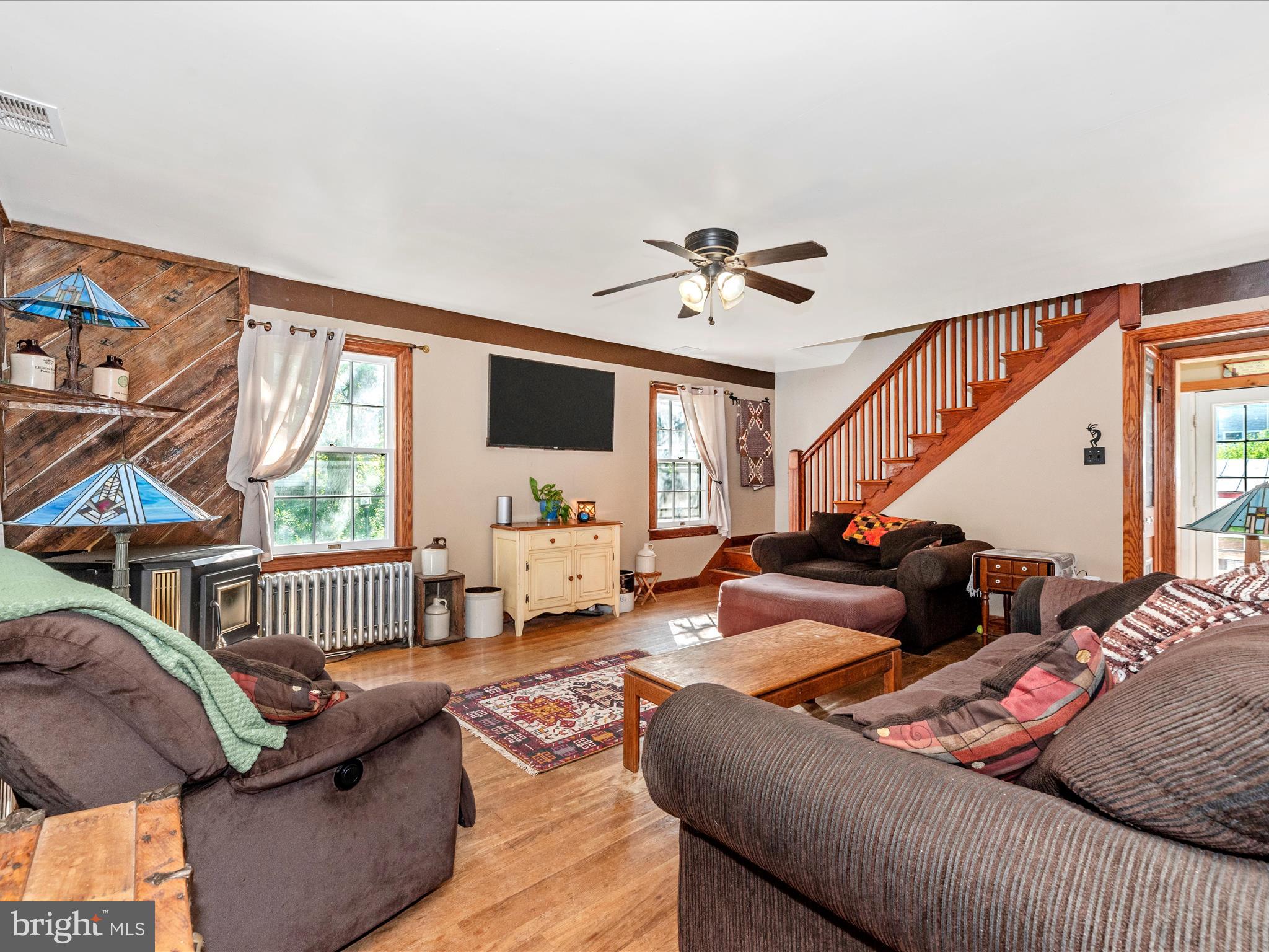 6103 Jefferson Pike Frederick, MD 21703 - Photo 6 of 57 a living room with furniture fireplace and a flat screen tv