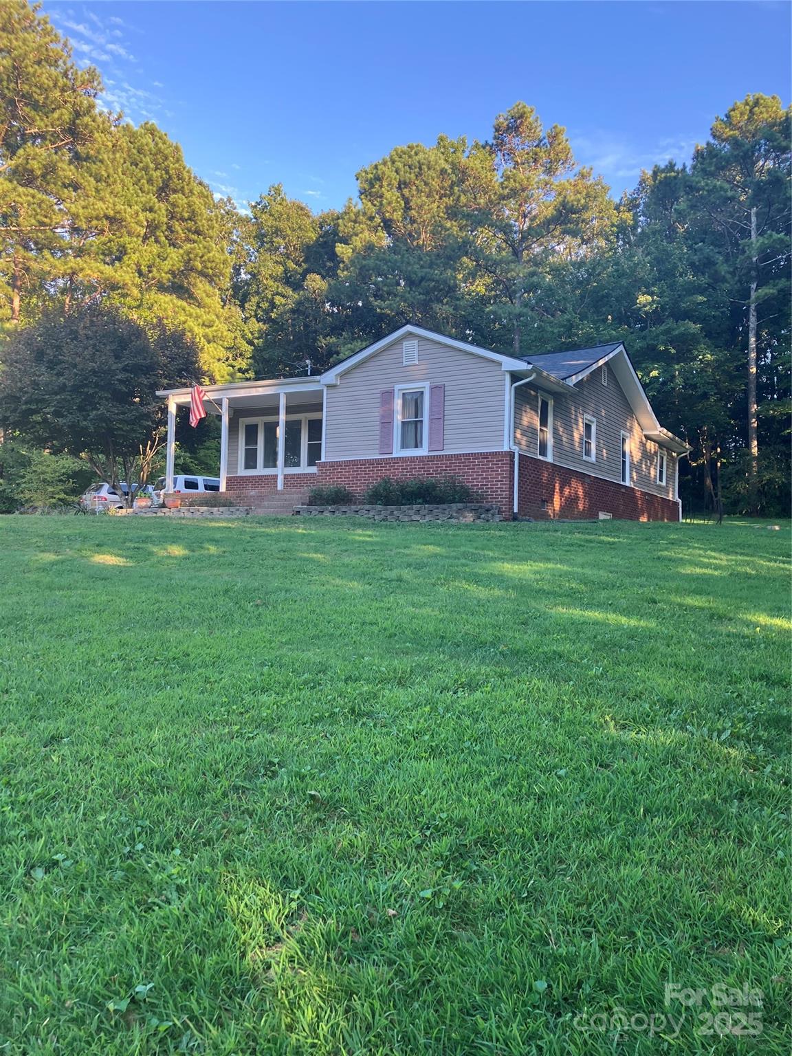 36704 Mauldin Road Albemarle, NC 28001 - Photo 1 of 33 a front view of a house with yard and green space